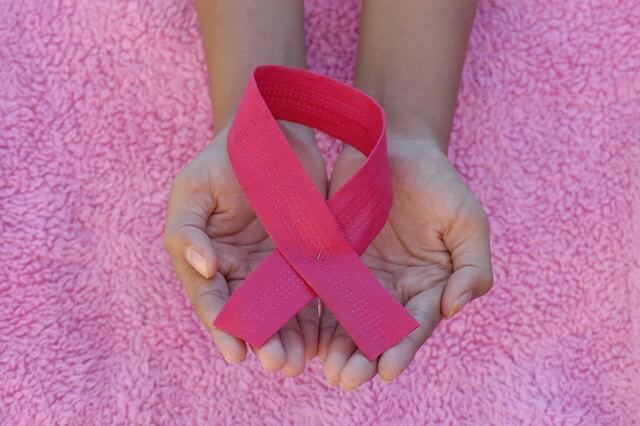 Pink ribbon showing sympathy and solidarity with cancer patients